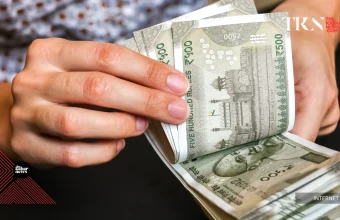 Rupee hits multi-week high as falling oil prices boost market sentiment